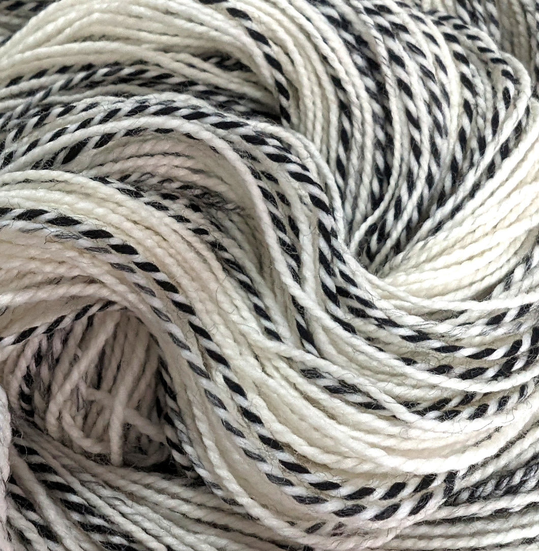 Undyed Superwash merino/nylon 'zebra' sock yarn.