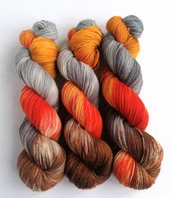 Load image into Gallery viewer, Embers Revised on a high twist Superwash Merino/Nylon sock yarn. freeshipping - Felt Fusion
