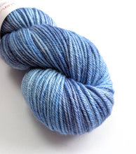Load image into Gallery viewer, Dusty Blue Jeans on superwash BFL/silk DK yarn.
