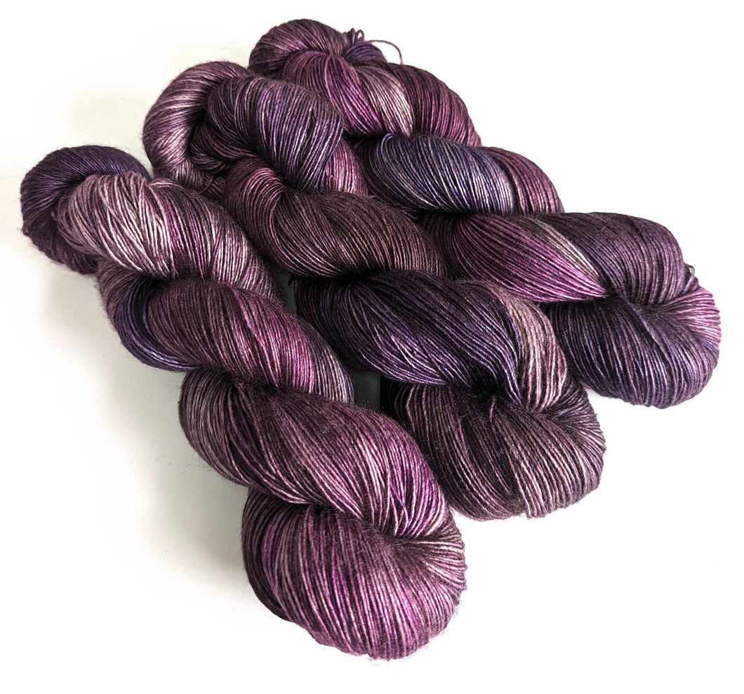 Purples on superwash merino/silk/yak 4ply singles. 120g.