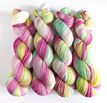 Load image into Gallery viewer, A Christmas Rose on superwash Merino/nylon/sparkle sock yarn.
