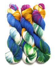 Load image into Gallery viewer, Bedknobs and Broomsticks on superwash Merino/nylon/sparkle sock yarn.
