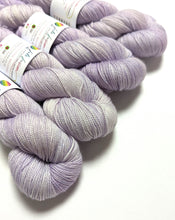 Load image into Gallery viewer, Lilac on superwash merino/nylon/sparkle sock yarn.
