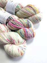 Load image into Gallery viewer, Not Quite Advent Speckles on superwash merino/cashmere/nylon sock yarn.

