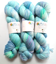 Load image into Gallery viewer, Sea Foam, on a superwash Merino/nylon/sparkle sock yarn.
