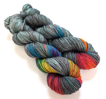 Load image into Gallery viewer, Dark Winter Rainbow on superwash merino/nylon sock yarn.
