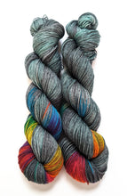 Load image into Gallery viewer, Dark Winter Rainbow on superwash merino/nylon sock yarn.
