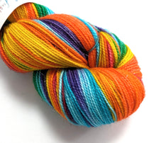 Load image into Gallery viewer, Rainbow on superwash Merino/nylon/sparkle sock yarn.

