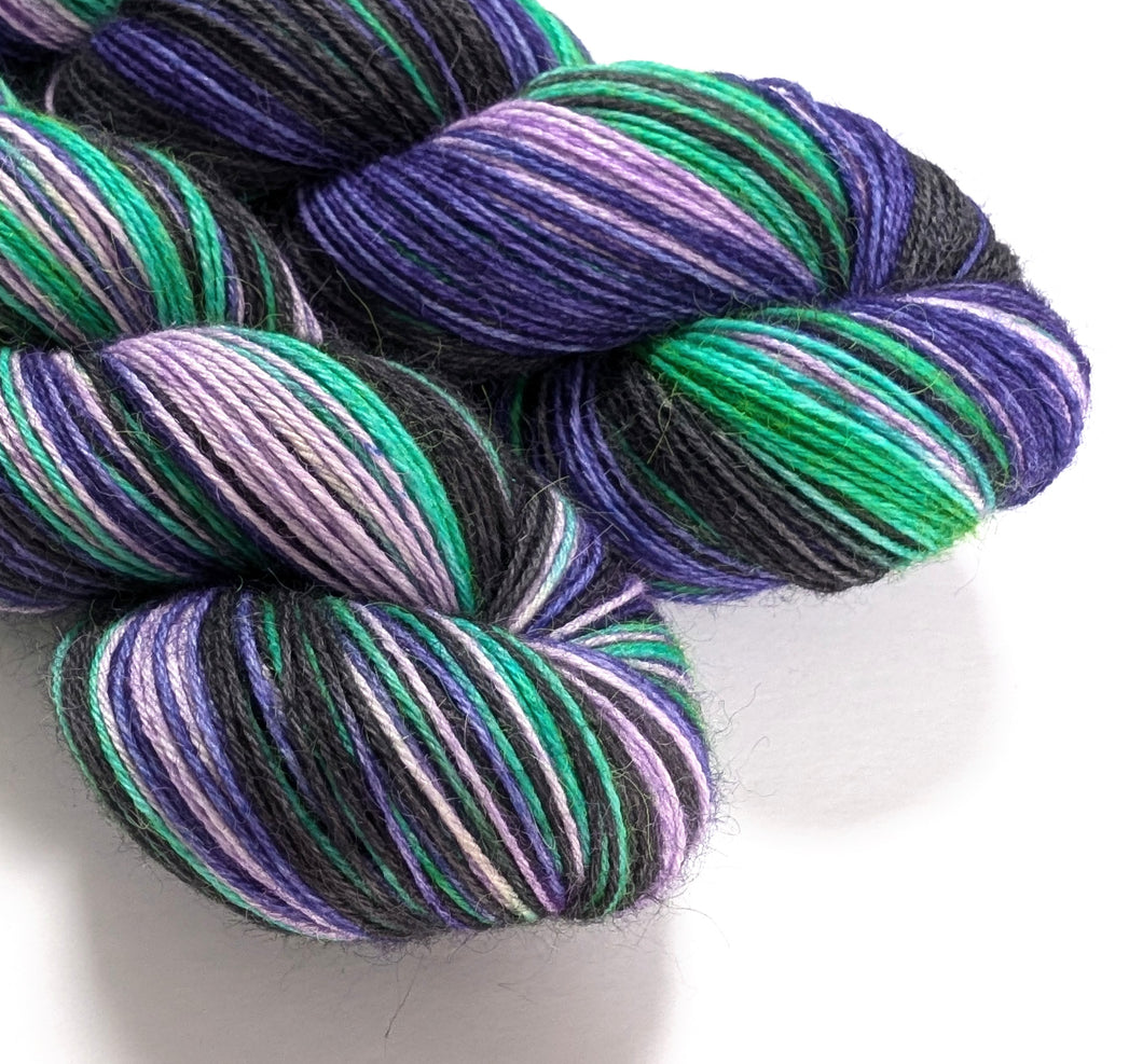 Witches' Brew on 100% llama 4ply/fingering weight yarn. Natural base.