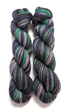Load image into Gallery viewer, Witches&#39; Brew on 100% llama 4ply/fingering weight yarn. Grey base.
