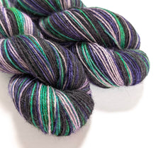 Load image into Gallery viewer, Witches&#39; Brew on 100% llama 4ply/fingering weight yarn. Grey base.
