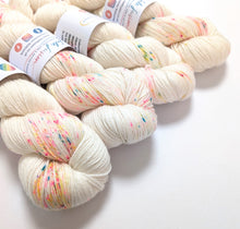 Load image into Gallery viewer, Snot Cake on superwash merino/bamboo 4ply/fingering weight.
