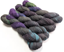 Load image into Gallery viewer, Set of multicolored yarn skeins on a white background
