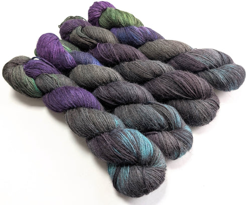 Set of multicolored yarn skeins on a white background