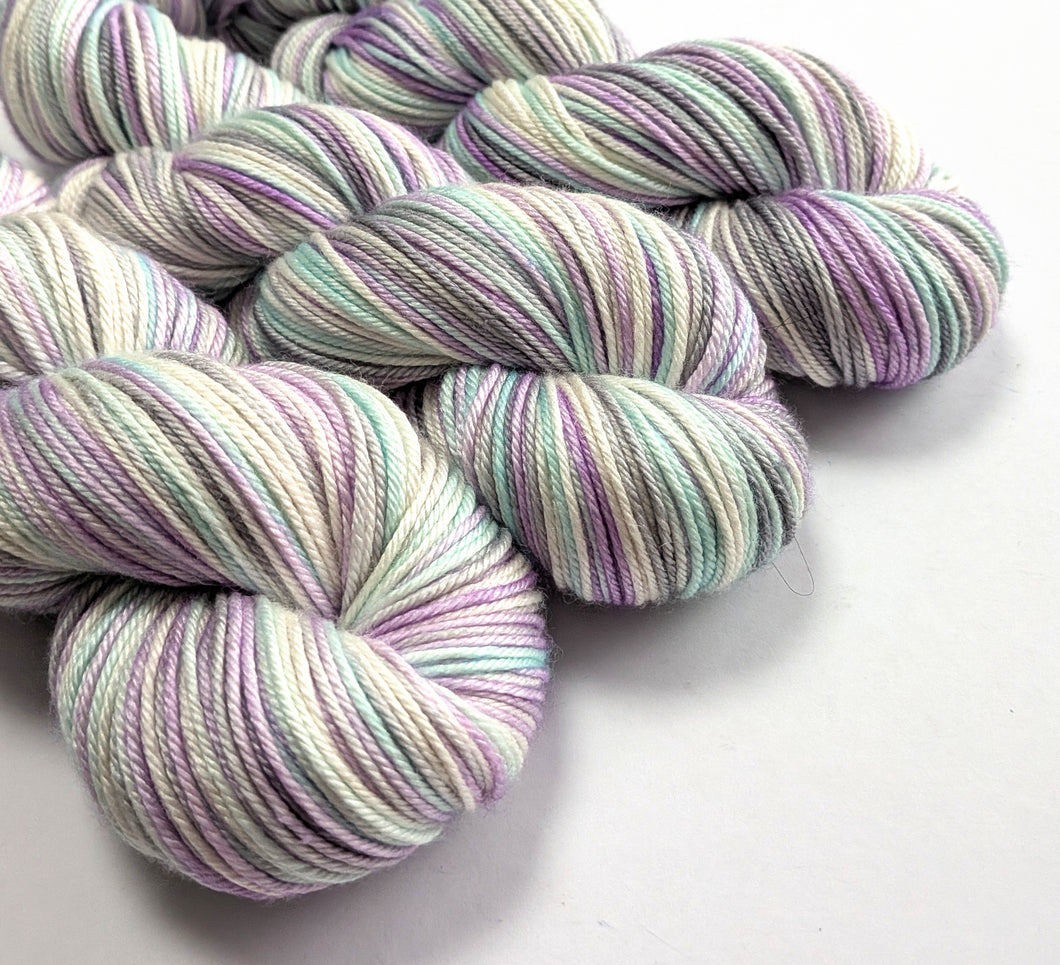 Multicolored yarn skeins on a white background