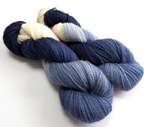 Load image into Gallery viewer, Two skeins of yarn in navy, blue, and cream on a white background
