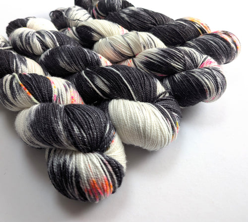  skeins of multicolored yarn on a white background