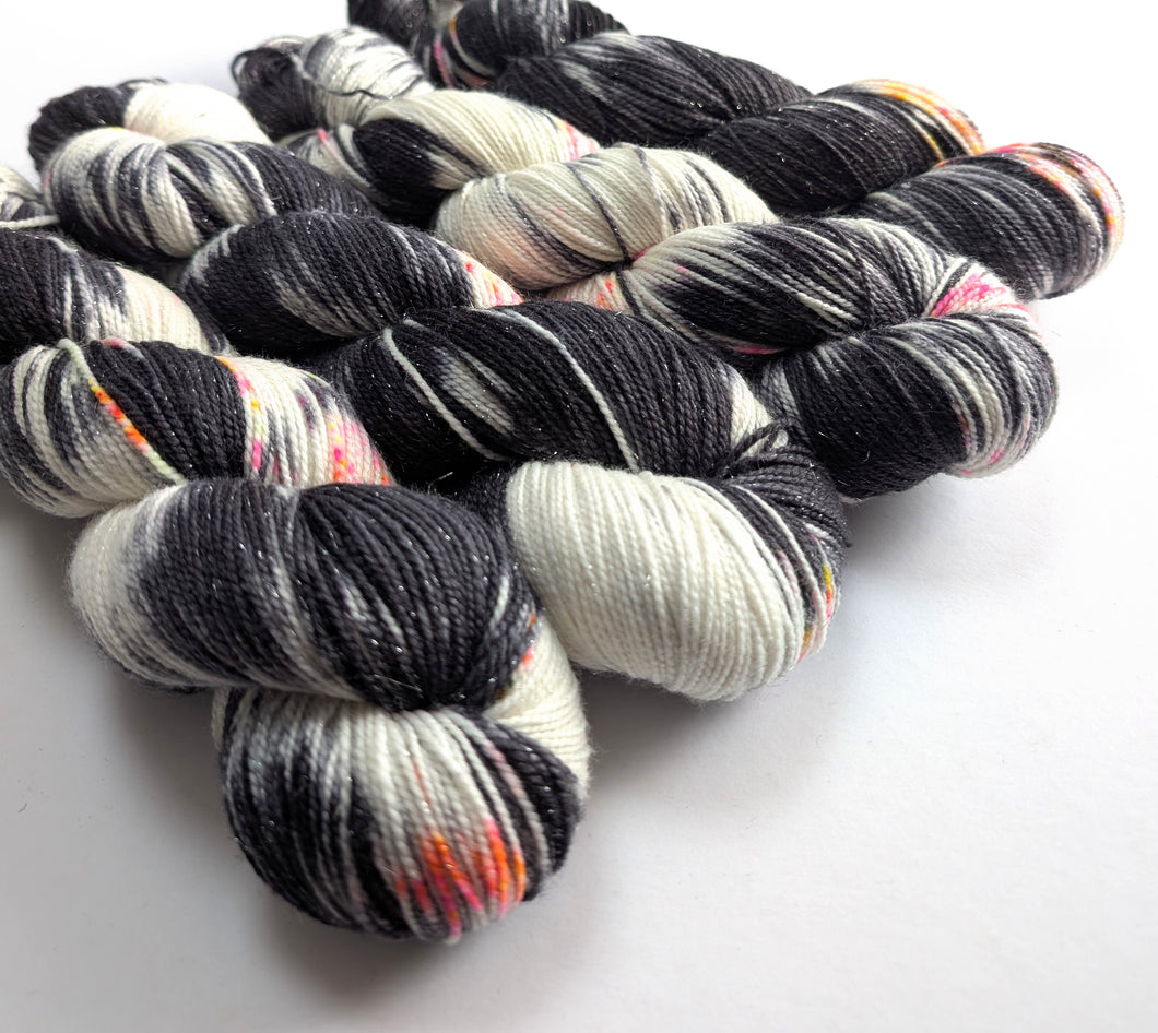  skeins of multicolored yarn on a white background