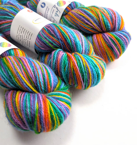 Colorful skeins of yarn with labels on a white background