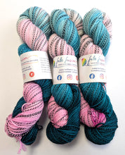 Load image into Gallery viewer, Three skeins of pink and teal yarn with felted yarn label on a white background
