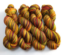 Load image into Gallery viewer, Multicolored yarn skeins on a white background
