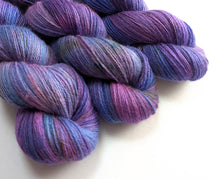 Load image into Gallery viewer, Three skeins of purple and blue yarn on a white background
