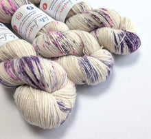 Load image into Gallery viewer, Gothic Speckles on 100% llama 4ply/fingering weight yarn.
