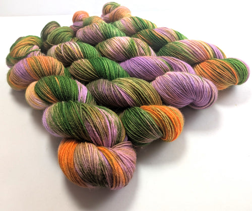 Multicolored yarn skeins on a white background