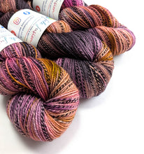 Load image into Gallery viewer, Multicolored skeins of yarn with labels on a white background
