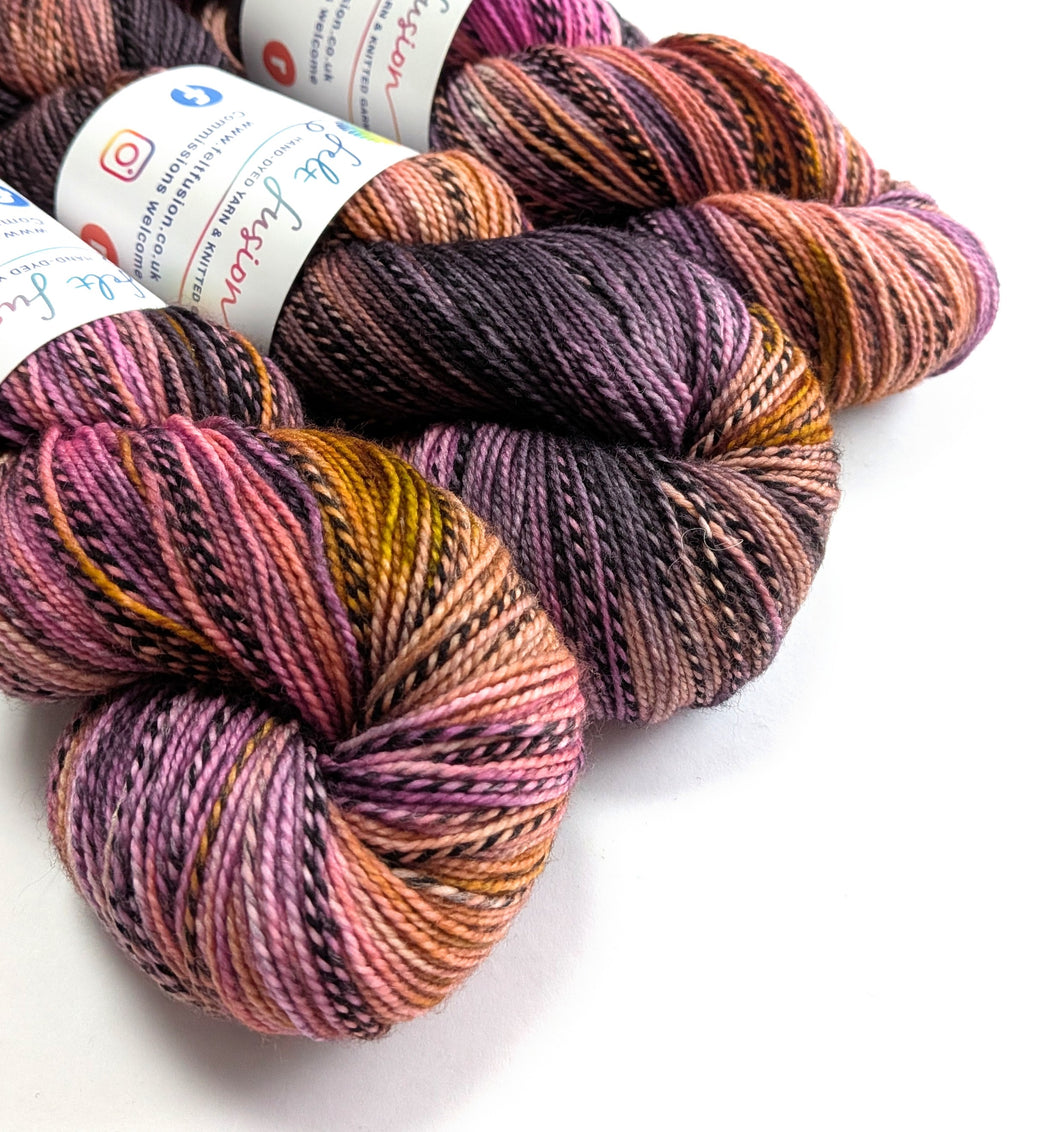 Multicolored skeins of yarn with labels on a white background