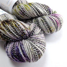 Load image into Gallery viewer, Two skeins of multicolored yarn on a white background
