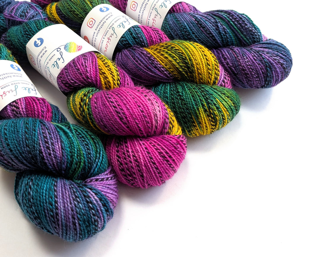 Colorful yarn skeins on a white background