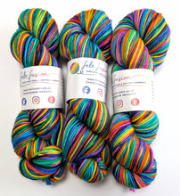 Load image into Gallery viewer, Wintertime Rainbow on superwash merino/cashmere/nylon DK yarn.
