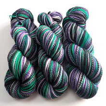 Load image into Gallery viewer, Three skeins of multicolored yarn on a white background
