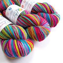 Load image into Gallery viewer, Multicolored yarn skeins with labels on a white background

