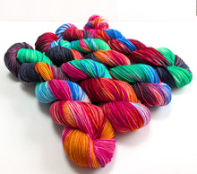 Load image into Gallery viewer, Multicoloured skeins of yarn on a white background
