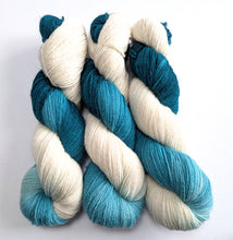 Load image into Gallery viewer, Three skeins of yarn with teal and white gradient on a white background

