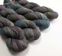 Load image into Gallery viewer, Multicolored skeins of yarn on a white background
