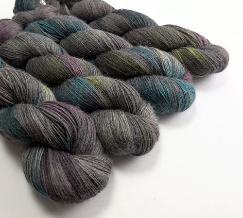Multicolored skeins of yarn on a white background