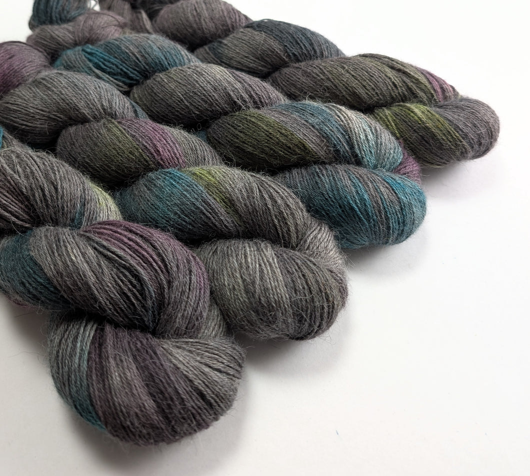 Multicolored skeins of yarn on a white background