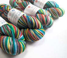 Load image into Gallery viewer, Colorful yarn skeins with labels on a white background
