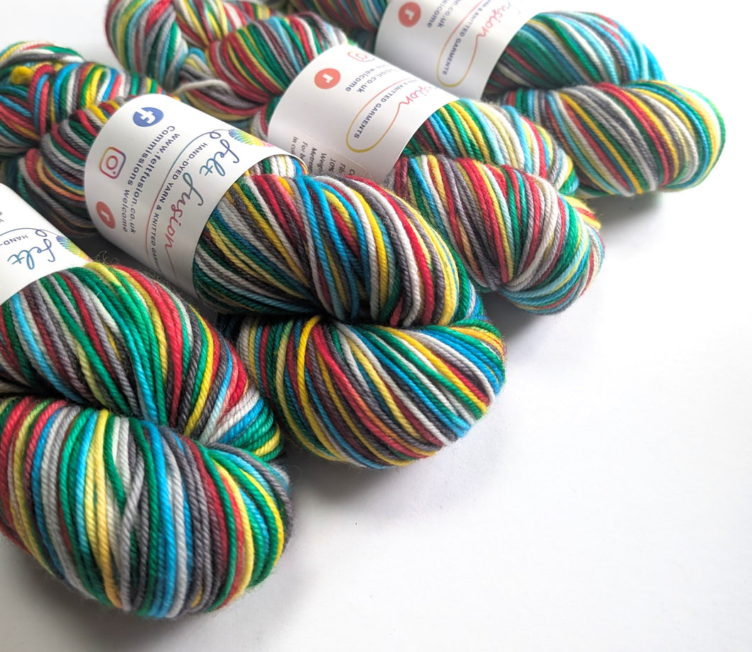 Colorful yarn skeins with labels on a white background