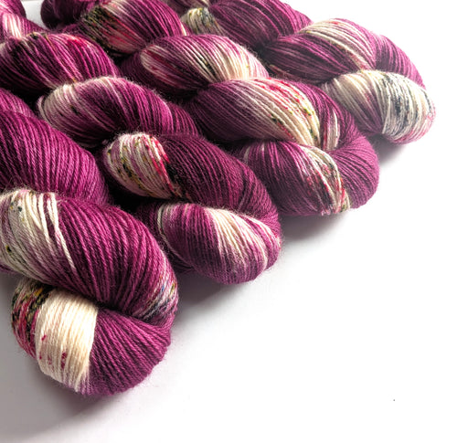 Skeins of multicoloured yarn on a white background