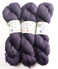 Load image into Gallery viewer, Three skeins of purple yarn with labels on a white background
