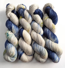 Load image into Gallery viewer, Four skeins of variegated yarn.
