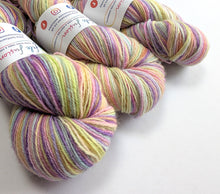 Load image into Gallery viewer, Three skeins of pastel yarn with labels on a white background
