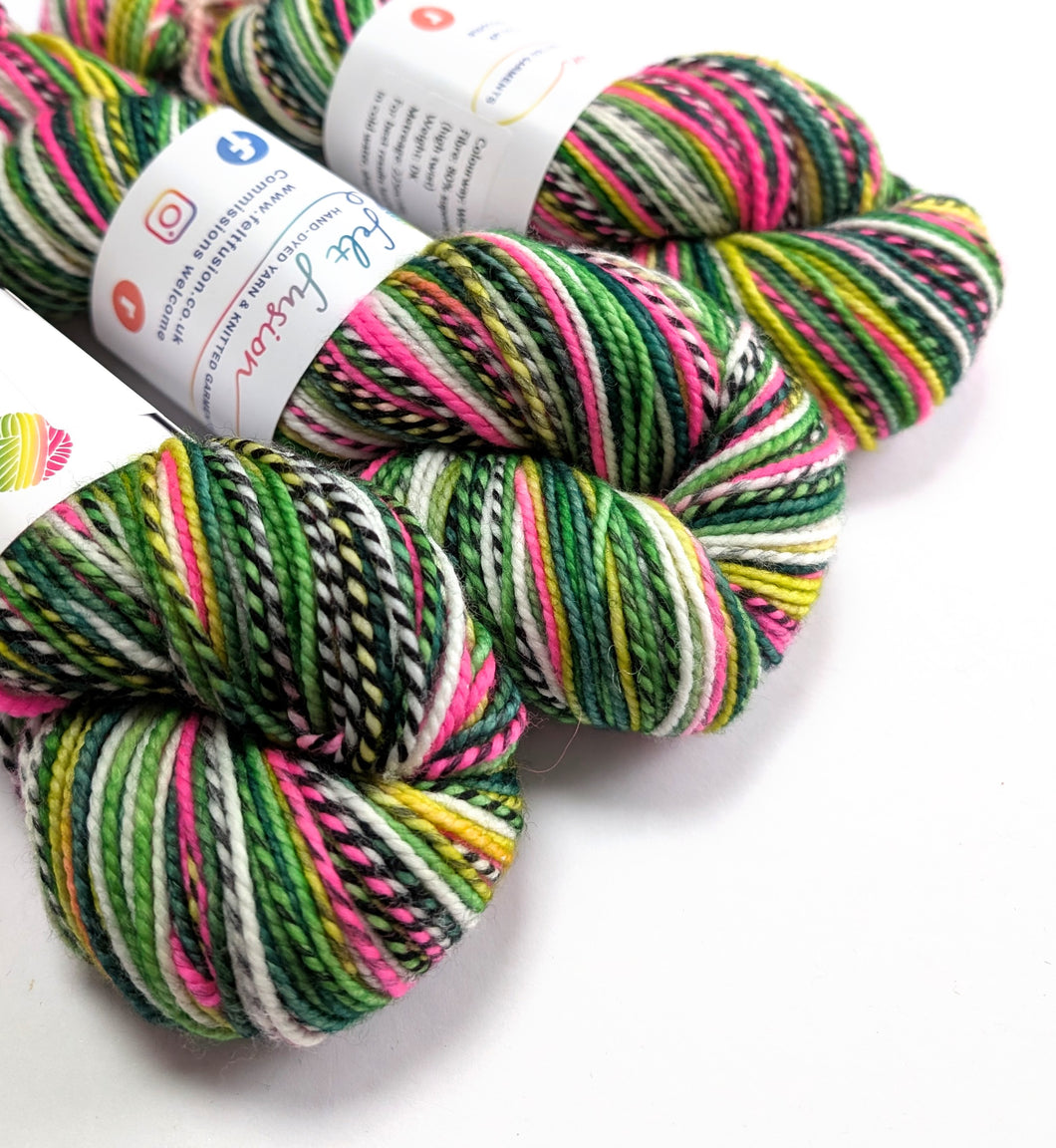 Multicolored yarn skeins with a visible brand label on a white background