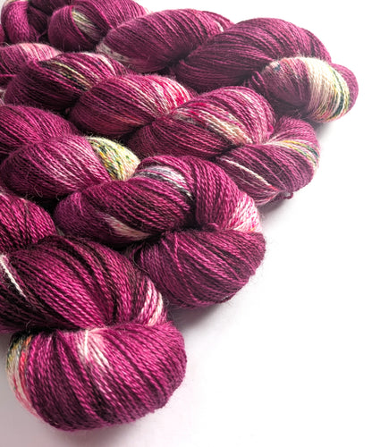 Skeins of multicolored yarn on a white background