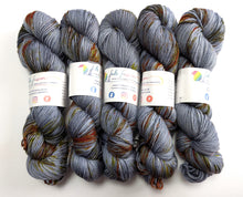 Load image into Gallery viewer, Five skeins of multicoloured yarn with visible brand labels on a white background
