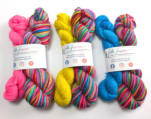 Colorful skeins of yarn with visible branding on a white background